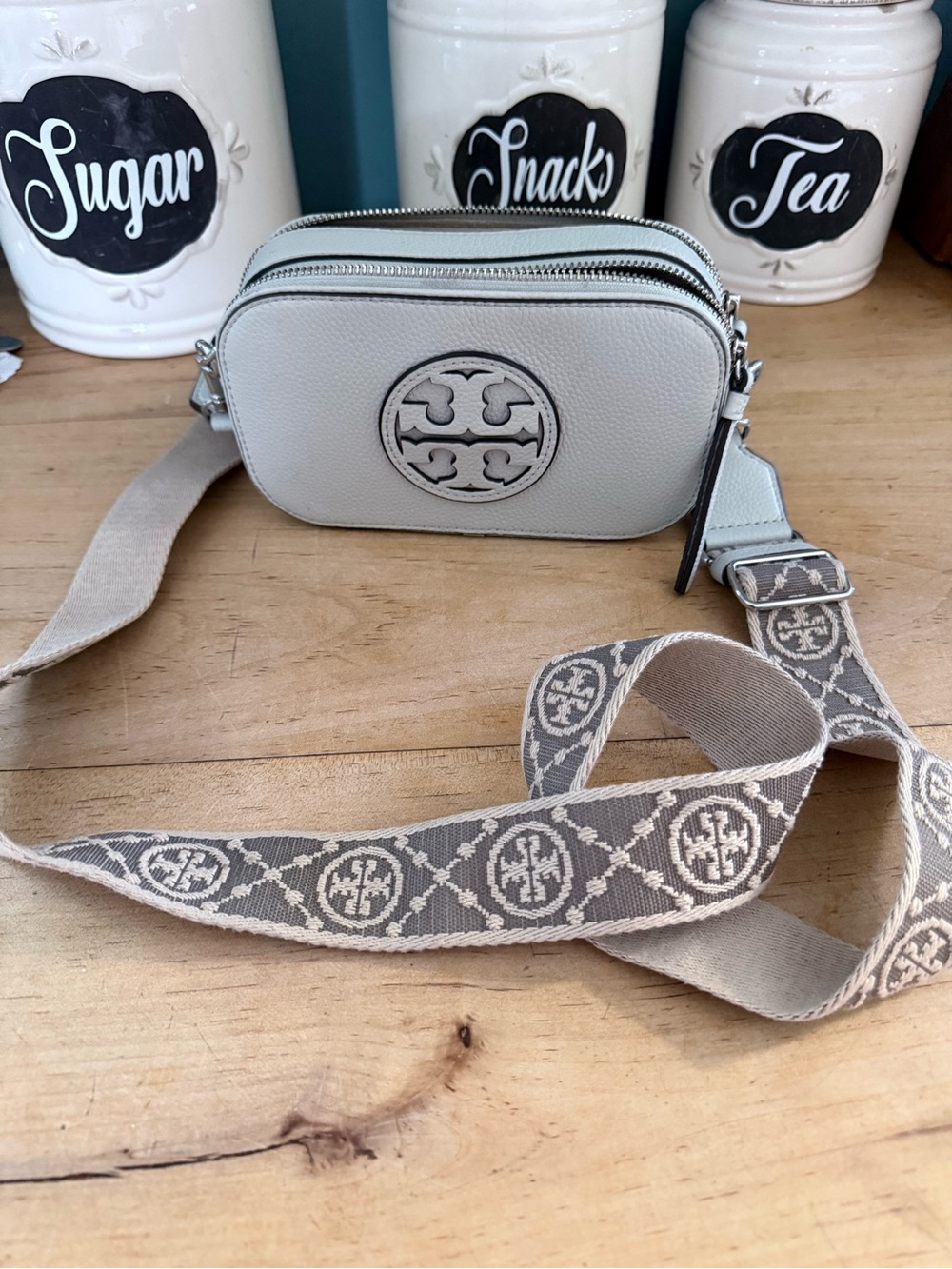 Tory Burch Pebbled Light Gray Leather Camera Crossbody with Patterned Logo Strap